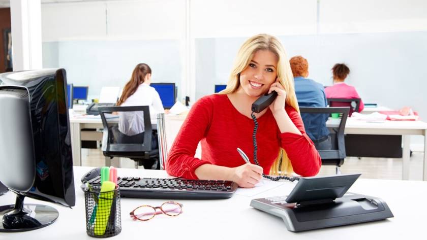 A bustling call center floor with agents actively engaged in assisting customers, highlighting the peak activity of a busy call center