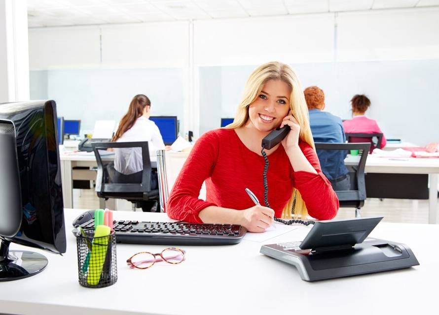 A bustling call center floor with agents actively engaged in assisting customers, highlighting the peak activity of a busy call center