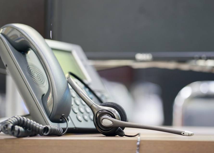 A landline phone symbolically connecting to a mobile phone, illustrating the concept of call forwarding from a landline to a mobile device