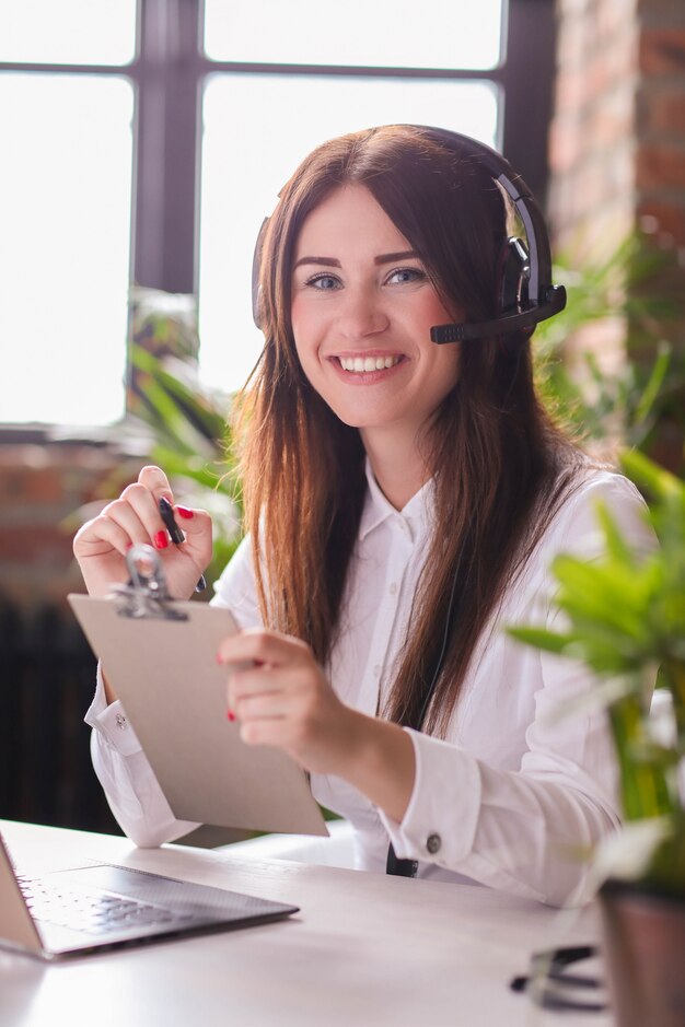 An image representing a cloud-based hosted contact center solution, with various communication tools and a cloud icon