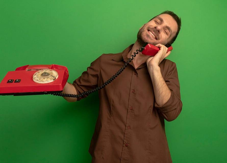 A landline phone symbolically redirecting a call to a mobile device, representing the process of landline call diversion